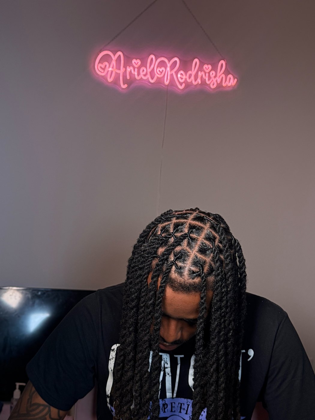 Men's stitch braids taken straight down the parting, rows feeding back